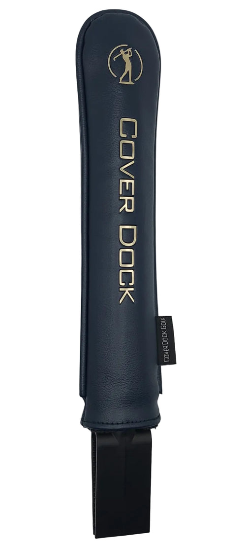 A dark navy blue leather golf club cover sleeve with gold lettering that reads 'COVER DOCK' and a gold logo, shown against a light gray background.