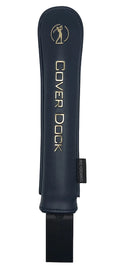 A dark navy blue leather golf cover with gold lettering that reads 'COVER DOCK' and a gold decal, shown against a light gray background.