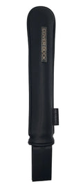 A black protective dock sleeve with a silver metallic 'COVER DOCK' logo plaque on the left side and a black elastic strap extending from the right. The product is photographed horizontally on a plain light gray background.